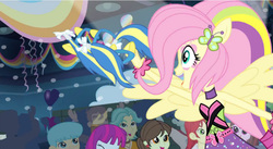 Size: 852x468 | Tagged: safe, screencap, brawly beats, bright idea, curly winds, drama letter, fluttershy, mystery mint, nolan north, some blue guy, sophisticata, teddy t. touchdown, velvet sky, watermelody, equestria girls, g4, my little pony equestria girls: rainbow rocks, shake your tail, armpits, background human, bare shoulders, crowd, cute, female, huggable, male, ponied up, rainbow rocks outfit, shyabetes, sleeveless, strapless