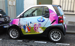 Size: 1238x762 | Tagged: safe, princess cadance, shining armor, a canterlot wedding, g4, season 2, advertisement, car, irl, itasha, paris, photo, smart car, smart fortwo, tiji