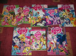 Size: 3472x2604 | Tagged: safe, idw, apple bloom, applejack, fluttershy, pinkie pie, princess celestia, princess luna, rainbow dash, rarity, scootaloo, spike, sweetie belle, twilight sparkle, alicorn, pony, g4, comics, cutie mark crusaders, dvd, dvds, female, high res, irl, mane six, mare, merchandise, photo, twilight sparkle (alicorn)