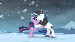 Size: 1365x768 | Tagged: safe, screencap, shining armor, twilight sparkle, g4, the crystal empire, clothes, hug, scarf, snow, snow goggles, snowfall