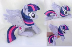 Size: 1105x722 | Tagged: safe, artist:epicrainbowcrafts, twilight sparkle, alicorn, pony, g4, beanie (plushie), female, irl, mare, photo, plushie, prone, sitting, solo, spread wings, twilight sparkle (alicorn)