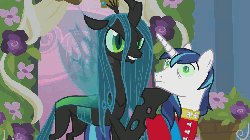 Size: 1024x576 | Tagged: safe, screencap, queen chrysalis, shining armor, changeling, changeling queen, a canterlot wedding, g4, animated, close-up, face shove, female, flapping, flower, gloating, mind control, sneer