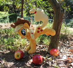 Size: 3531x3258 | Tagged: safe, artist:sirdragonlance, applejack, earth pony, pony, g4, apple, applebucking, applejack mid tree-buck facing the left with 3 apples falling down, applejack mid tree-buck with 3 apples falling down, falling, food, irl, photo, plushie, solo