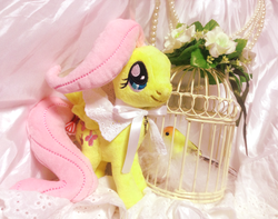Size: 751x591 | Tagged: safe, fluttershy, bird, pegasus, pony, g4, asklolitashy, bow, cage, female, flower, irl, mare, photo, plushie, solo, spread wings, wings