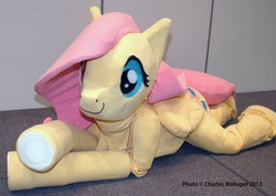 Size: 902x642 | Tagged: safe, artist:lasiral, fluttershy, g4, 2013, convention, cosplay, fursuit, irl, ottawa comiccon, ponysuit, prone, quadsuit, solo