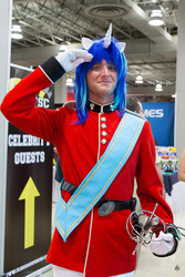 Size: 853x1280 | Tagged: artist needed, safe, shining armor, human, g4, 2013, clothes, cosplay, florida supercon, gloves, irl, irl human, photo, rapier, salute, solo, sword, uniform, weapon