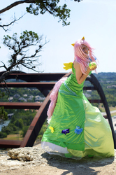 Size: 1275x1920 | Tagged: safe, artist:kibou-eli, fluttershy, human, parasprite, g4, clothes, cosplay, dress, gala dress, irl, irl human, outdoors, photo, plushie, solo