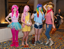 Size: 2000x1532 | Tagged: safe, artist:patcave, applejack, fluttershy, pinkie pie, rainbow dash, human, g4, 2012, bandana, clothes, convention, converse, cosplay, fingerless gloves, gloves, irl, irl human, momocon, momocon 2012, photo, plushie, tutu