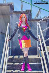 Size: 640x960 | Tagged: safe, artist:littlemissbloo, sunset shimmer, human, equestria girls, g4, boots, clothes, cosplay, irl, irl human, leather jacket, looking at you, outdoors, photo, pose, solo, stairs