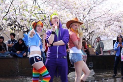 Size: 4080x2720 | Tagged: safe, artist:donknnj, artist:yinghai83, applejack, rainbow dash, spike, human, g4, 2012, clothes, cosplay, gloves, irl, irl human, midriff, northern california cherry blossom festival, photo, rainbow socks, scroll, shorts, socks, striped socks