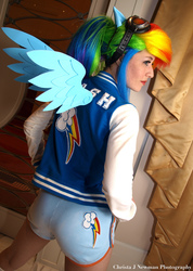 Size: 1462x2048 | Tagged: safe, artist:scruffyrebel, rainbow dash, human, g4, 2012, ass, butt, clothes, convention, cosplay, female, goggles, irl, irl human, jacket, katsucon, katsucon 2012, photo, print clothing, shorts, solo, varsity jacket