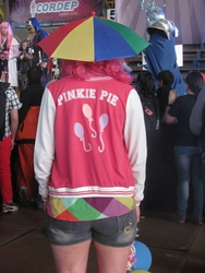 Size: 555x740 | Tagged: safe, artist:lowi bovino, pinkie pie, human, g4, clothes, convention, cosplay, hat, irl, irl human, jacket, photo, print clothing, solo, umbrella hat, varsity jacket