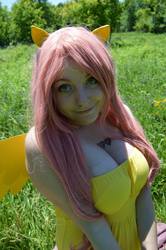 Size: 1361x2048 | Tagged: safe, artist:tikkanii, fluttershy, human, g4, cleavage, cosplay, female, irl, irl human, photo, smiling, solo, tattoo