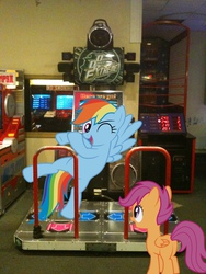 Size: 1536x2048 | Tagged: safe, artist:dreamcasterpegasus, artist:proenix, artist:tamalesyatole, rainbow dash, scootaloo, g4, arcade, butt, dance dance revolution, irl, photo, plot, ponies in real life, rhythm game, vector, wink