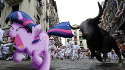 Size: 650x366 | Tagged: safe, artist:krazy3, artist:ojhat, twilight sparkle, bull, human, pony, unicorn, g4, building, irl, photo, ponies in real life, running with the bulls, solo, spain, twilight sparkle is not amused, unamused, unicorn twilight