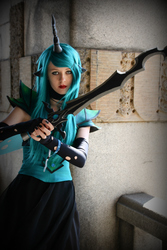 Size: 1353x2030 | Tagged: safe, artist:sewingintherain, queen chrysalis, human, g4, action pose, clothes, convention, cosplay, crystal fair con, dress, irl, irl human, photo, solo, sword
