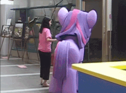 Size: 478x351 | Tagged: safe, twilight sparkle, human, 2011 my little pony fair, my little pony fair, g4, official, animated, costume, fail, irl, irl human, photo, quadsuit, tail, youtube link