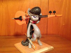 Size: 1024x768 | Tagged: safe, artist:mlpony46, octavia melody, earth pony, pony, g4, bipedal, carrying, cello, irl, musical instrument, octavia is not amused, photo, sculpture, solo, unamused