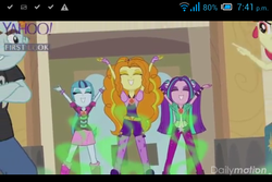 Size: 480x320 | Tagged: safe, screencap, adagio dazzle, apple bloom, aria blaze, snips, sonata dusk, equestria girls, g4, my little pony equestria girls: rainbow rocks, amulet, battle of the bands, cellphone, gem, hands up, hypnosis, jewelry, negative energy, pointing, singing, siren gem, the dazzlings