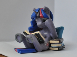 Size: 2014x1510 | Tagged: safe, artist:siejay, twilight sparkle, g4, book, irl, legs in air, on back, photo, reading, sculpture, underhoof