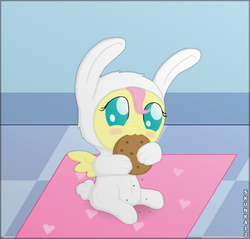Size: 600x574 | Tagged: dead source, safe, artist:skunk412, fluttershy, pony, g4, baby, baby pony, babyshy, bunny costume, bunnyshy, clothes, cookie, cute, eating, female, foal, nibbling, shyabetes, sitting, solo, weapons-grade cute, younger