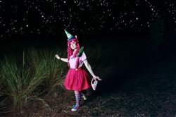 Size: 960x639 | Tagged: safe, artist:jakotsu-chan, gummy, pinkie pie, human, g4, 2012, basket, clothes, convention, cosplay, hat, holiday matsuri, irl, irl human, night, party hat, pet, photo, plushie, skirt, socks, solo, striped socks, suspenders