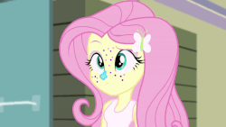 Size: 900x506 | Tagged: safe, screencap, fluttershy, equestria girls, g4, my little pony equestria girls: rainbow rocks, animated, cute, female, frown, glitter, open mouth, raised eyebrow, shyabetes, smiling, solo, talking