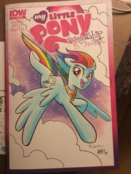 Size: 768x1024 | Tagged: safe, artist:tonyfleecs, rainbow dash, pegasus, pony, cloud, cloudy, comic, cover, element of loyalty, female, flying, looking at you, mare, necklace, open mouth, smiling, solo, spread wings, traditional art