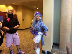 Size: 3264x2448 | Tagged: safe, artist:mieucosplay, trixie, human, bronycon, bronycon 2014, g4, boots, clothes, convention, cosplay, fishnet stockings, gloves, hand on hip, hat, high res, irl, irl human, pantyhose, photo, pinkie spy, rule 63, skirt, solo, stockings, tailcoat, trixie's cape, trixie's hat, tube skirt