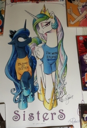Size: 500x737 | Tagged: safe, artist:andypriceart, princess celestia, princess luna, bronycon, g4, andy price, angry, bedroom eyes, blame my sister, clothes, floppy ears, frown, glare, i'm with stupid, looking at you, raised hoof, shirt, signature, smiling, smirk, t-shirt, text on clothing, text on shirt, traditional art, unamused