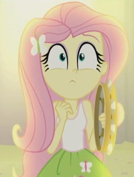 Size: 618x819 | Tagged: safe, screencap, fluttershy, equestria girls, g4, my little pony equestria girls: rainbow rocks, face, female, musical instrument, spotlight, tambourine