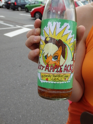 Size: 1500x2000 | Tagged: safe, applejack, g4, bottle, car, close-up, concrete, convention, drawing, hand, irl, juice, photo