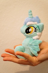 Size: 3264x4912 | Tagged: safe, artist:fafatacle, lyra heartstrings, sea pony, g4, cute, hand, in goliath's palm, irl, lyrabetes, photo, plushie, seapony lyra, size difference, solo, species swap