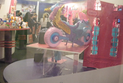 Size: 1021x692 | Tagged: safe, sugarcoat, human, sea pony, equestria girls, g4, my little pony equestria girls: friendship games, irl, irl human, london toy fair, merchandise, motorcycle, photo
