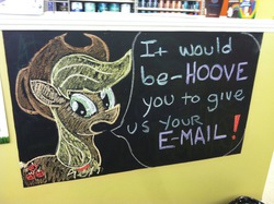 Size: 1118x835 | Tagged: safe, applejack, g4, chalkboard, dialogue, female, looking at you, looking back, open mouth, photo, pun, sign, solo, text