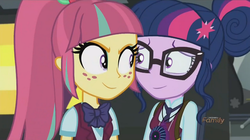 Size: 893x500 | Tagged: safe, screencap, sci-twi, sour sweet, twilight sparkle, equestria girls, g4, my little pony equestria girls: friendship games, bowtie, discovery family logo, eye contact, glasses, ponytail