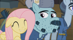 Size: 1964x1094 | Tagged: safe, screencap, fluttershy, hacksaw mccolt, leadnail mccolt, earth pony, pegasus, pony, g4, the hooffields and mccolts, discovery family logo, eyes closed, floppy ears, hat, lip bite, mccolt family, smiling
