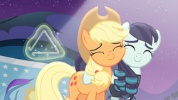 Size: 1901x1075 | Tagged: safe, screencap, applejack, coloratura, g4, season 5, the mane attraction, hug, musical instrument, nuzzling, rara, sweetie belle's magic brings a great big smile, triangle
