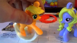 Size: 1280x720 | Tagged: safe, applejack, lily blossom, human, g4, brony, irl, irl human, mcdonald's happy meal toys, photo, toy