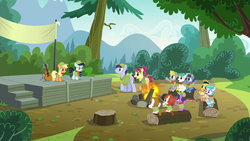 Size: 1280x720 | Tagged: safe, screencap, applejack, coloratura, lavandula, nature walk, paige, russell, shady blues, soft ice, summer joy, trailhead, wild card, pony, g4, the mane attraction, archie comics, background pony, camp friendship, cheering, clothes, colt, comic book, filly, food, glasses, hat, log, neckerchief, popcorn, scout uniform, shirt, smiling, unnamed character, unnamed pony, up