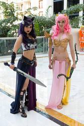 Size: 640x960 | Tagged: safe, artist:chubearcosplay, artist:lizbrickleycosplay, fluttershy, princess luna, human, g4, armor, belly button, bow (weapon), cleavage, cosplay, female, irl, irl human, loincloth, midriff, my little pony princess warriors, photo, sword, toes, unconvincing armor, weapon, wondercon, wondercon 2015