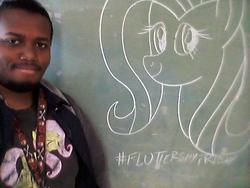 Size: 640x480 | Tagged: safe, artist:deon miller, fluttershy, human, g4, brony, chalkboard, clothes, irl, irl human, photo, t-shirt