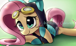 Size: 1039x630 | Tagged: safe, artist:rocy canvas, fluttershy, pegasus, pony, g4, bunny ears, clothes, costume, cute, dangerous mission outfit, female, goggles, green background, hoodie, looking at you, mare, pixiv, prone, shyabetes, simple background, smiling, solo, watermark
