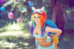 Size: 1024x678 | Tagged: safe, artist:babygirlfallenangel, rainbow dash, human, g4, belly button, cleavage, clothes, cosplay, female, irl, irl human, midriff, photo, skirt, sports bra