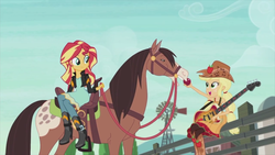 Size: 1920x1080 | Tagged: safe, screencap, applejack, sunset shimmer, horse, equestria girls, friendship through the ages, g4, apple, clothes, country applejack, female, guitar, sitting, sleeveless