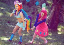 Size: 1024x729 | Tagged: safe, artist:babygirlfallenangel, pinkie pie, rainbow dash, human, g4, black underwear, bra strap, cleavage, clothes, cosplay, female, irl, irl human, midriff, photo, skirt, tail pull, underwear