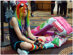 Size: 1000x750 | Tagged: safe, artist:ladyanidraws, rainbow dash, human, g4, babscon, babscon 2015, ball pit, clothes, convention, cosplay, dashcon, frown, irl, irl human, no fun allowed, photo, rainbow socks, socks, striped socks