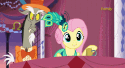 Size: 635x349 | Tagged: safe, screencap, discord, fluttershy, draconequus, pegasus, pony, g4, make new friends but keep discord, season 5, ahem, alternate hairstyle, animated, coughing, discovery family, discovery family logo, gif, logo