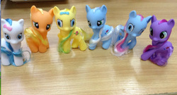 Size: 890x482 | Tagged: safe, earth pony, pony, aliexpress, bootleg, bow, cake toppers, concerned pony, hair bow, photo, toy, wat