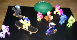 Size: 953x500 | Tagged: safe, artist:drpain, apple bloom, applejack, blues, flash sentry, lilac hearts, noteworthy, pursey pink, rainbow dash, thunderclap, wensley, g4, blind bag, flash sentry adventures, irl, photo, skateboard, skateboarding, toy